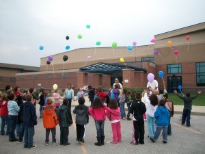 AYS kids celebrating with balloons