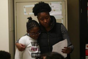 AYS program director reading to a student
