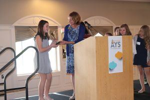 President and CEO Chrystal Struben presenting AYS Superstar Kid of the Year award at Lights On Luncheon 2018