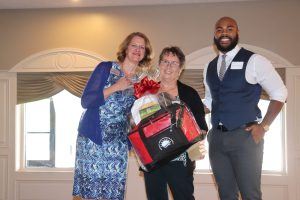 President and CEO Chrystal Struben with vacation winner at Lights On Luncheon 2018