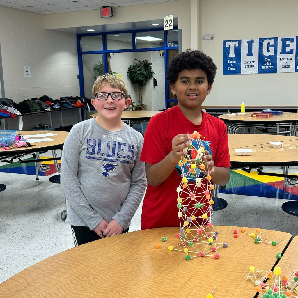 Kids building STEM gumdrop tower after school